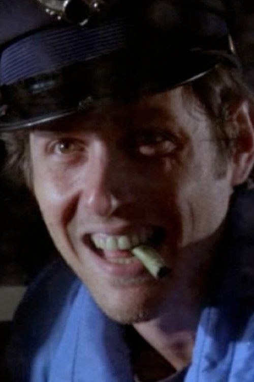 Patrick McCloskey as Officer at Police Dock