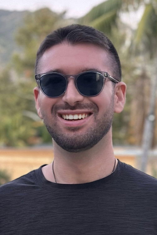 Ryan Delouya as Photographer / Receptionist