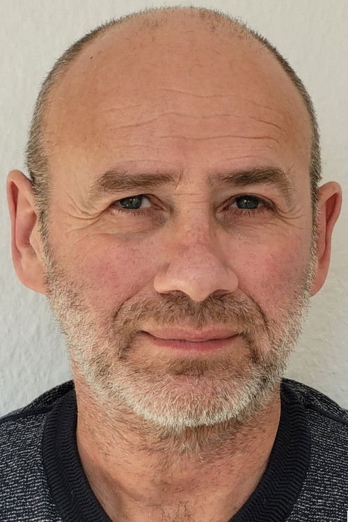 Mikhail Belinson as Human Trafficker (voice)