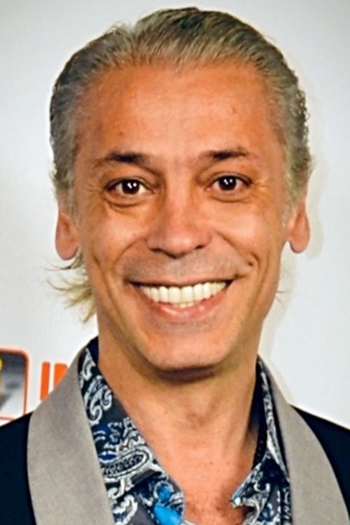 Karlos Granada as Erick - Horse Trainer