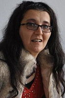 Adriana Macsut as Parishioner