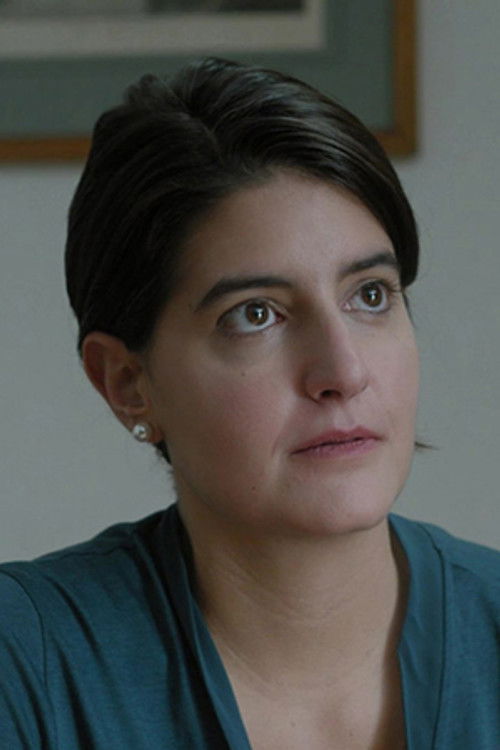 Evdoxia Androulidaki as Secretary