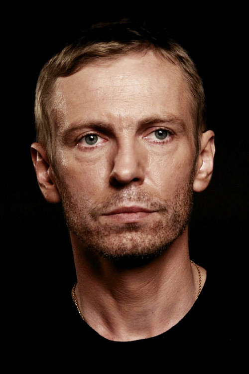 Šarūnas Bartas as The Man