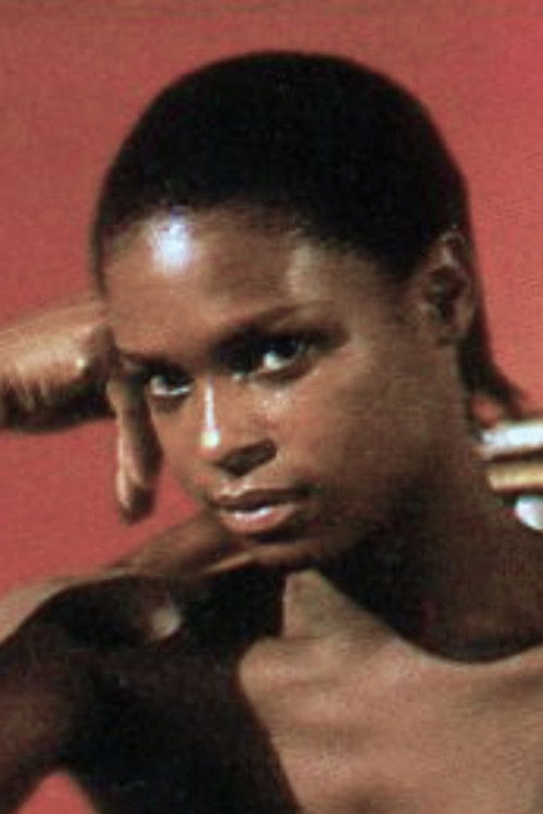 Patrice-Flora Praxo as Zeca