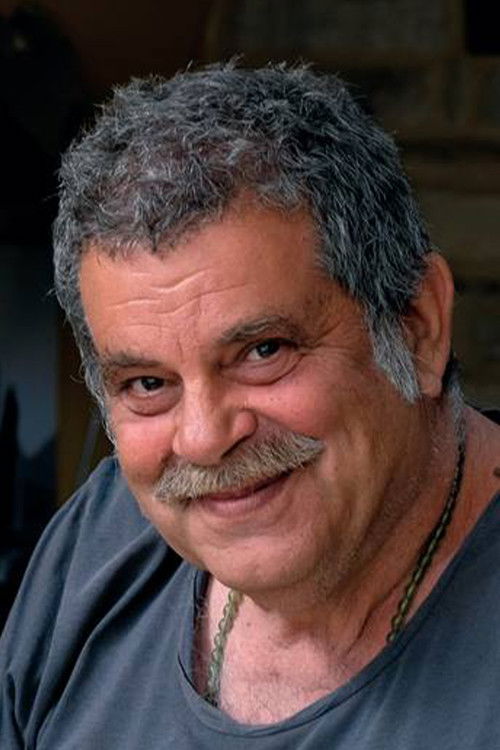 Kostas Gouzelis as Mini Market Owner