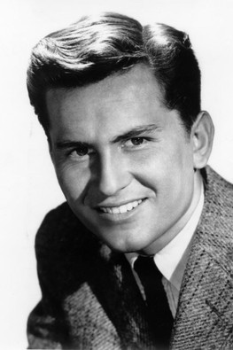 Billy Gray as Bobby Benson