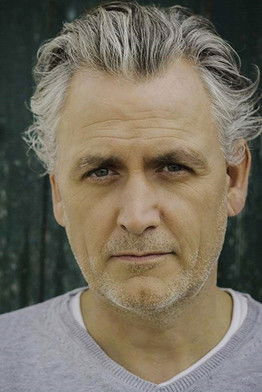 Julian Nicholson as Father Gray