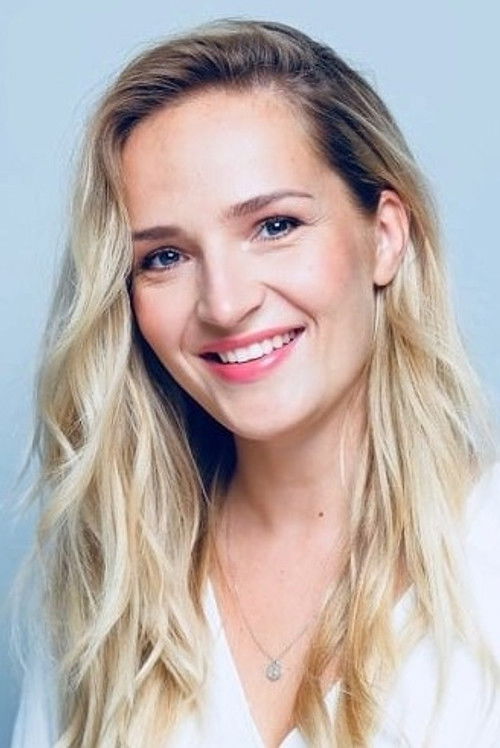 Marta Laan as Rass' Desk Mate