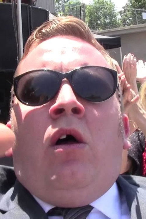 Cory Poucher as The Reverend Doctor Grinder