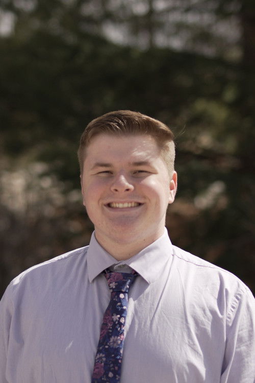 Owen Megura as The Voice