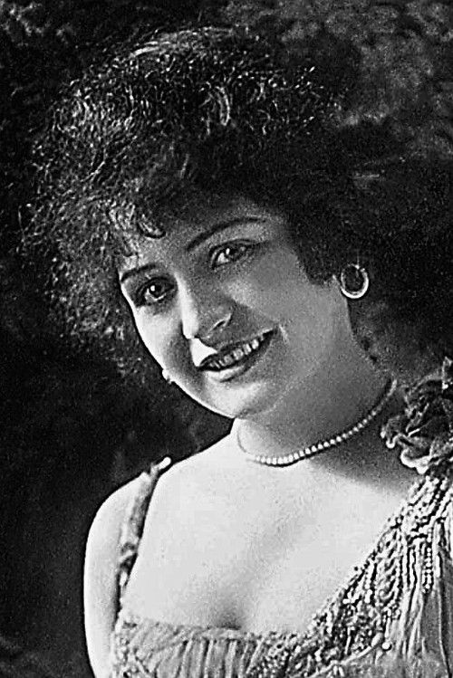 Margie Reiger as Man in Straw Hat's Wife