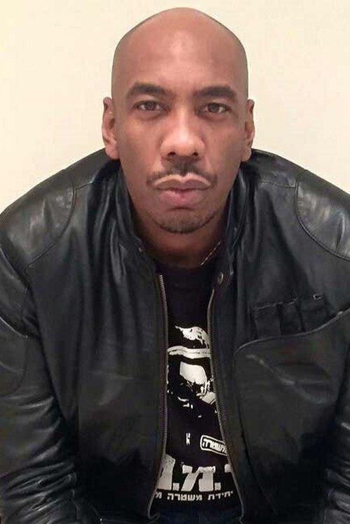 Douglas Embry as Funeral Attendee