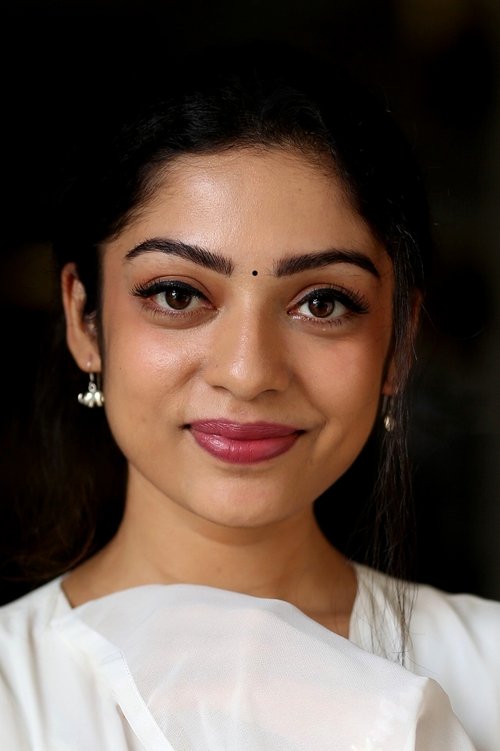 Varsha Bollamma as Trainee Photographer