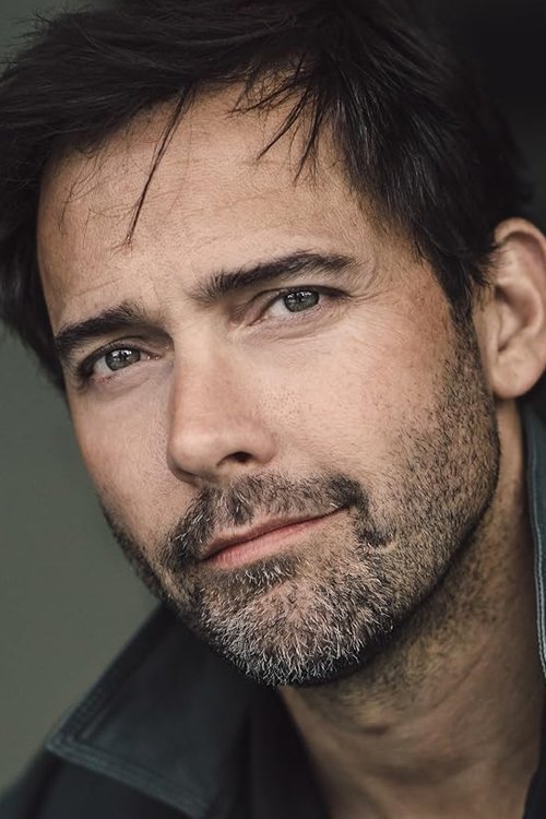 Andrew Bowen as Scott Cowley