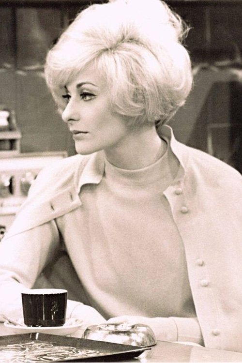 Noeline Brown as Mrs. Mortimer