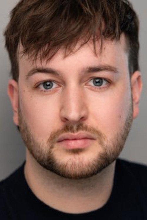 Ed Theakston as The Barman