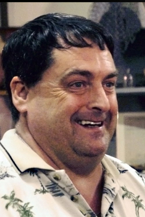 Mike DeGroote as Man in the Sea Museum Caretaker