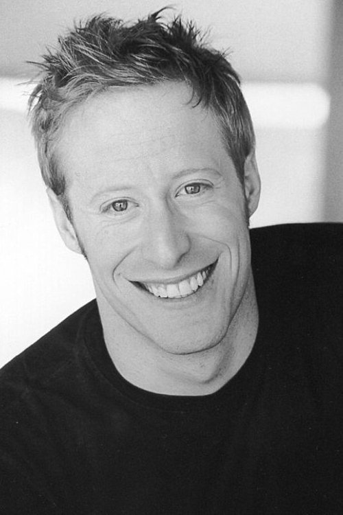 Josh Alexander as Newspaper Stand Boy