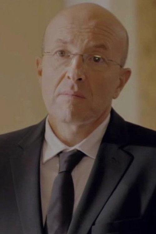 Hubert Rollet as Hearing Test Examiner