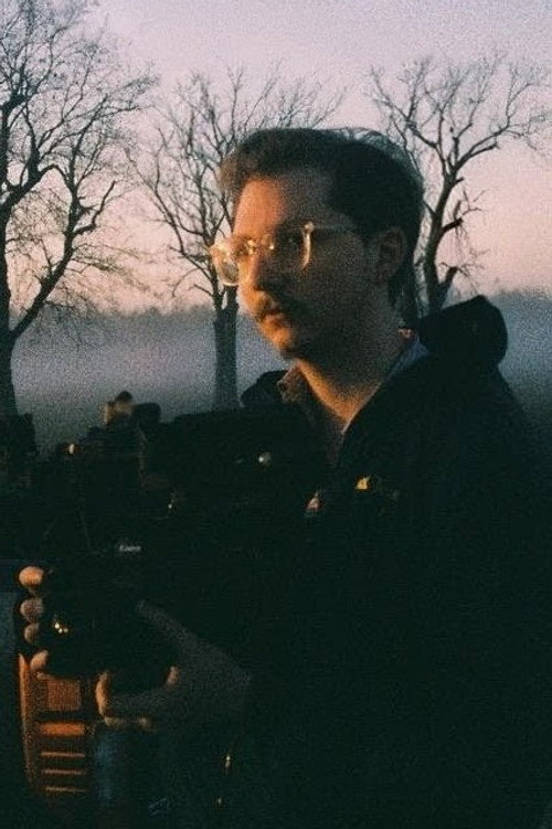 Devin Morgan as Photographer