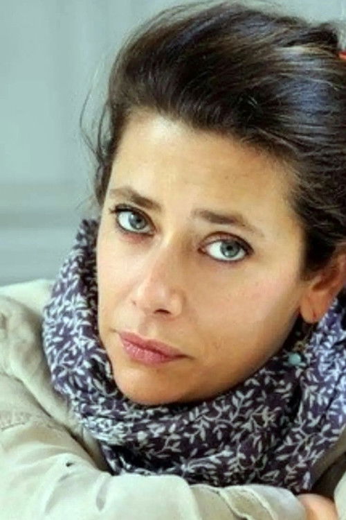 Giulia Foïs as TV Reporter (voice)