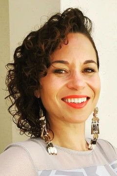 Charly Lowry as Kora