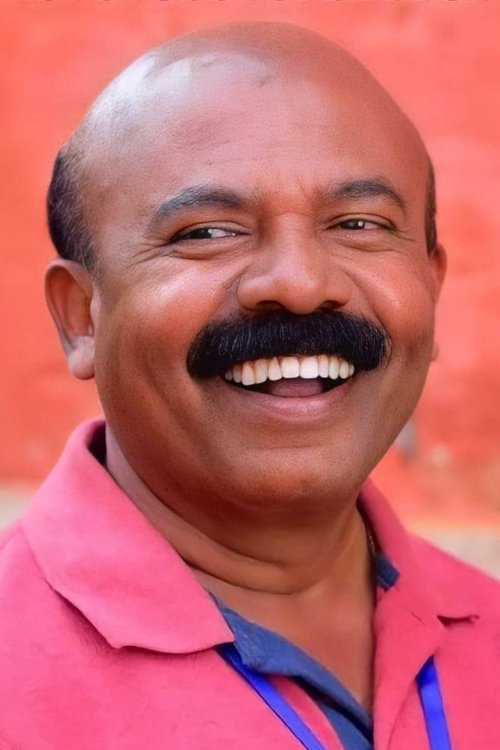 Pradeep Kottayam as Radhika's Father