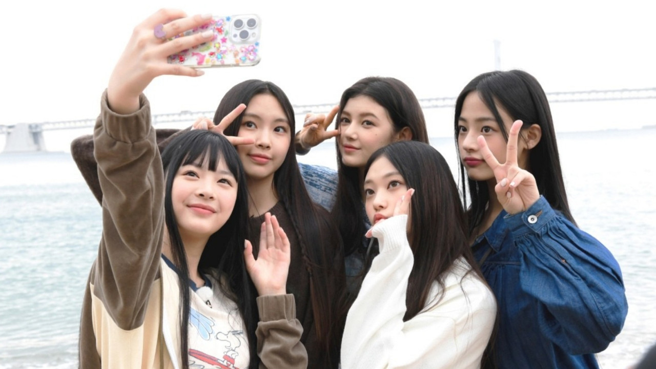 NewJeans Code in Busan backdrop