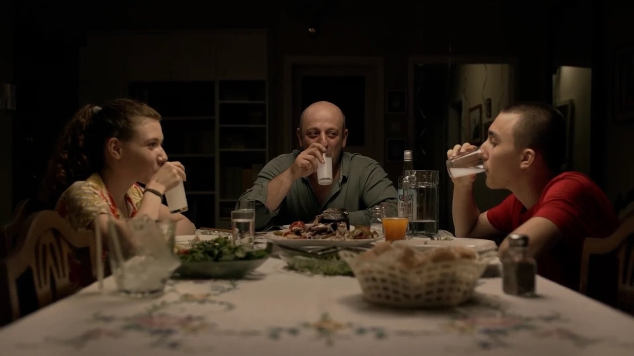 Ela and Hilmi with Ali backdrop