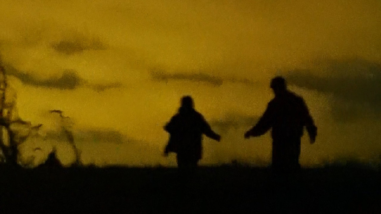 Figures Around a Fire backdrop