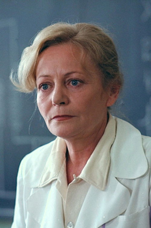 Hédi Temessy as Cloakroom Attendant