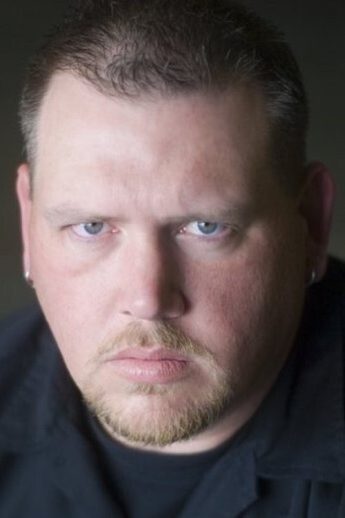 Jeremy Timmins as Blue Car Driver