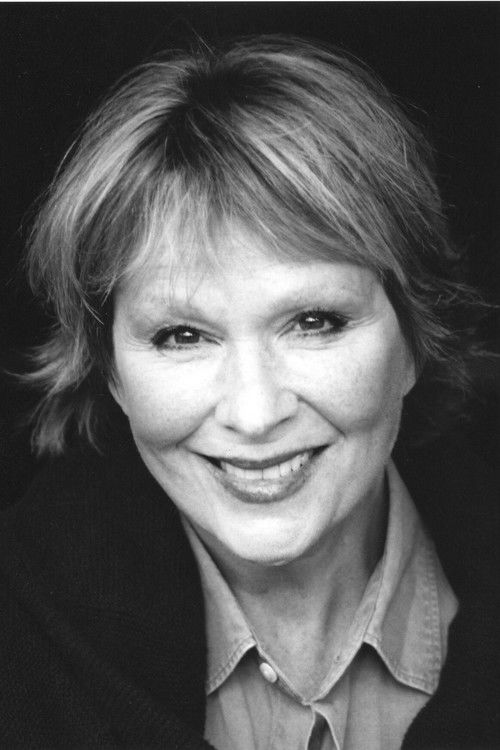 Lally Cadeau as Anita, Vrain's Secretary