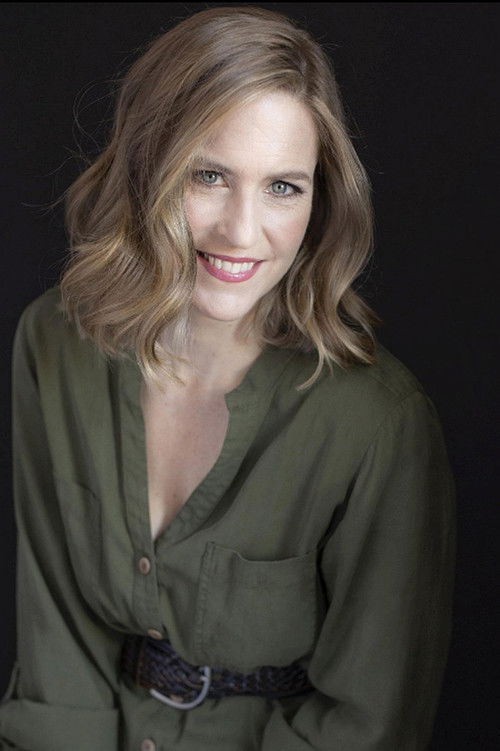 Kittson O'Neill as Newscaster #2