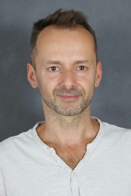 Marcin Szaforz as Adam Banek