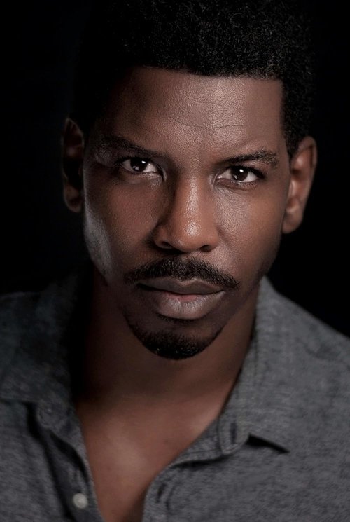 Derek Reginald as Man