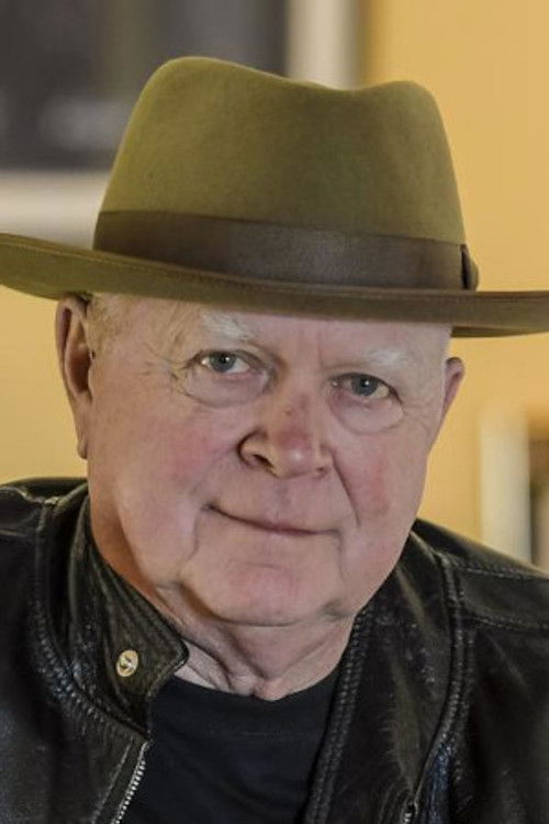 John Brewster as Guitar