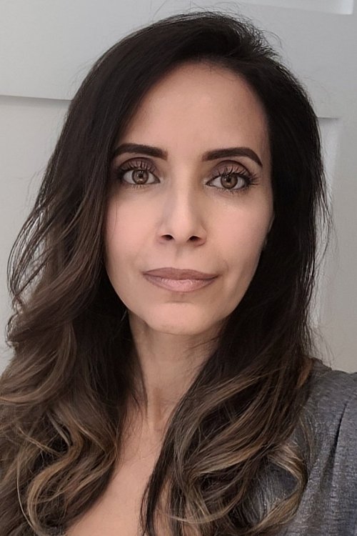 Anna Vlachos as News Anchor