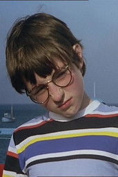 John Brewer as The Brat