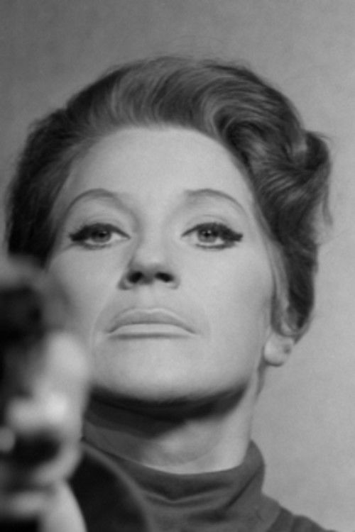 Ellika Mann as Female Prison Guard in the Interrogation Room