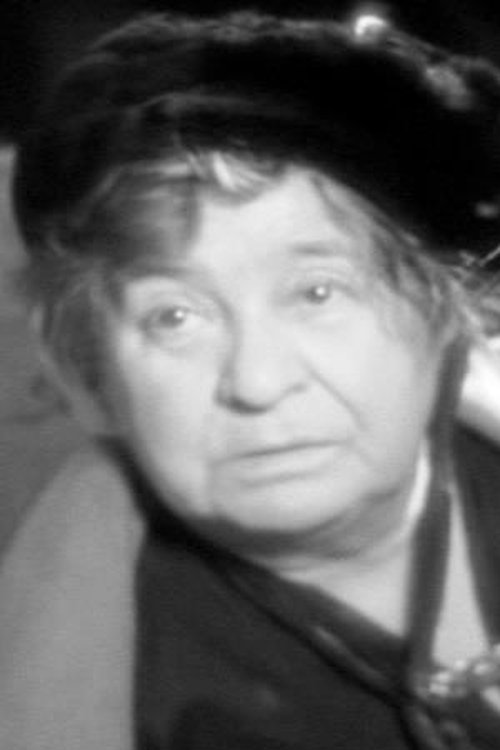 Clare Greet as Mrs. Parker