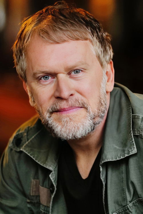 Dirc Simpson as Alpha