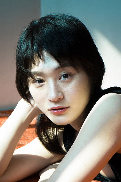 Komuai as Woman reading Moby Dick