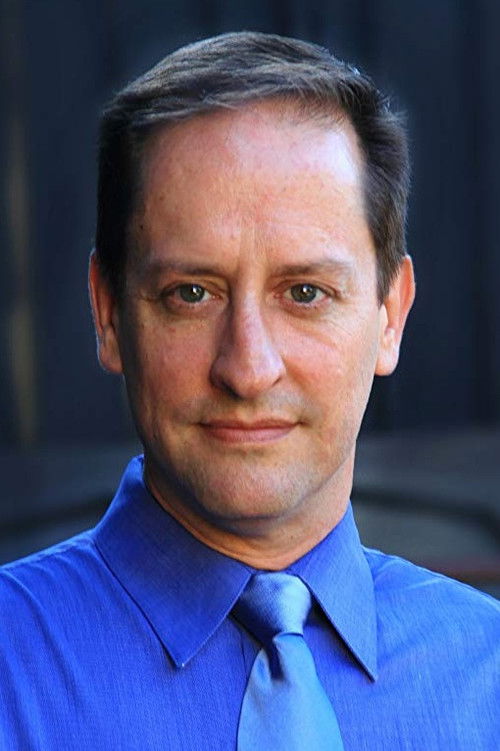 Sean Riley as Hooded Figure