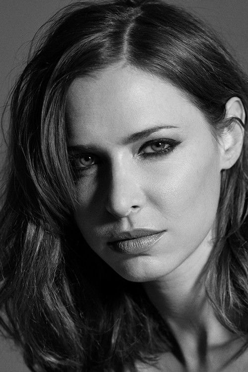 Nathalie Portela as TV Host