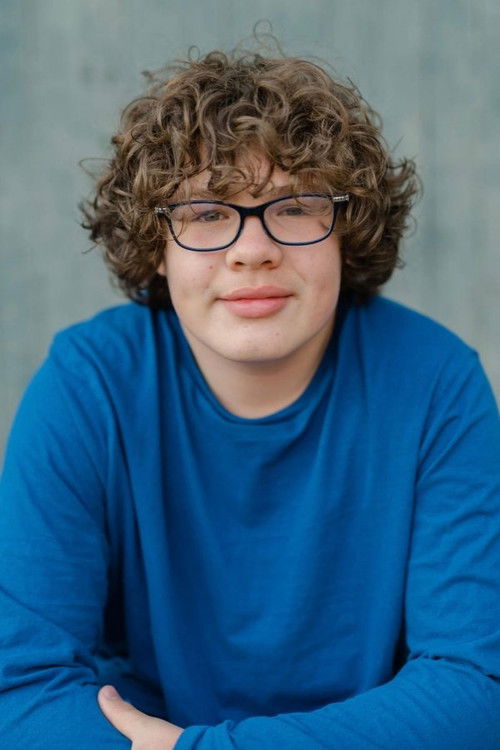 Alex Barber as Holiday Market Patron (uncredited)