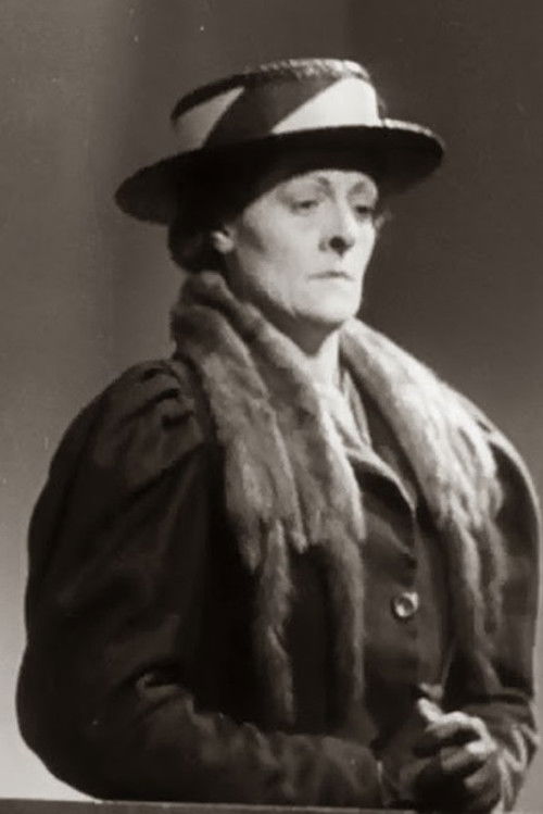 Sybil Grove as Mrs. Spurge