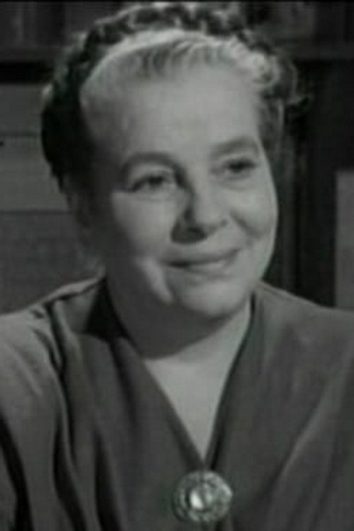Nora Gordon as Mrs. Griggs