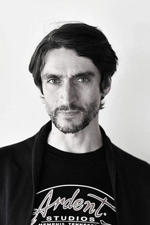 Reid Anderson as John Lennon