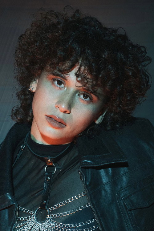 Sharon Torres as Vecina